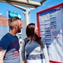 ... Couple looking at Bus Stop Timetable.jpg